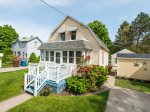 Cottage front with small deck and sunroom